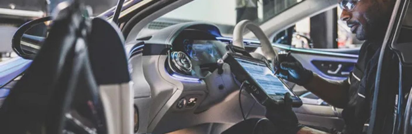 a technician performing a car inspection