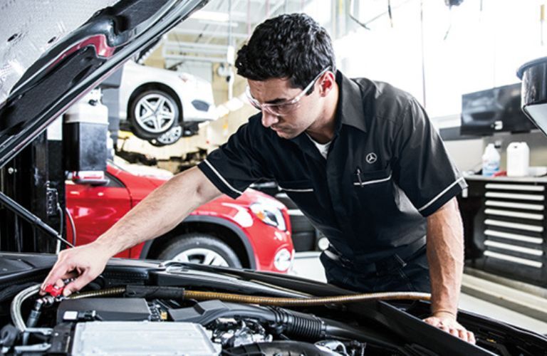 Mechanic checking the vehicle