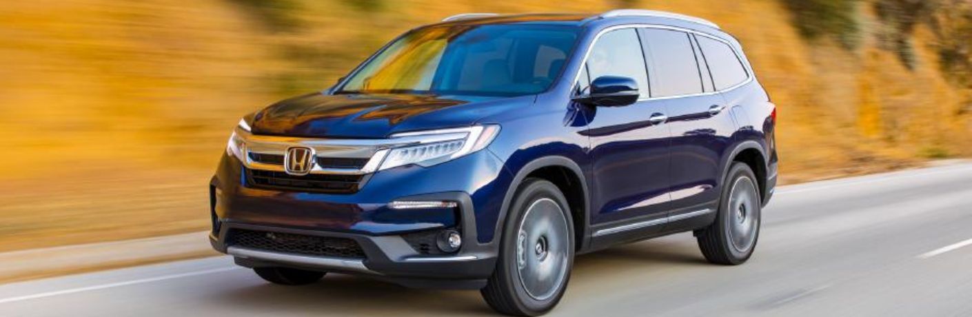 A 2021 Honda Pilot zipping on a smooth road