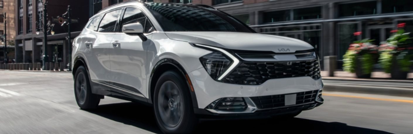 A 2023 Kia Sportage Hybrid on a city road