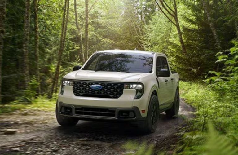 2025 Ford Maverick driving in a forest
