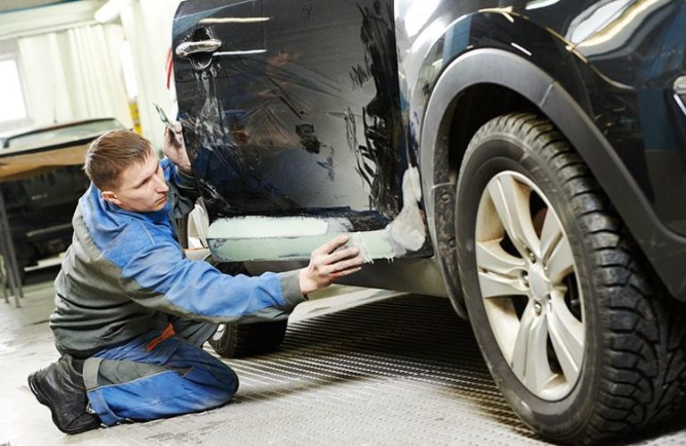 View of a damaged vehicle being repaired