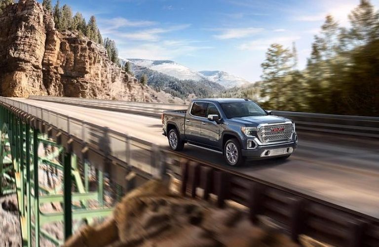 Used GMC Sierra crossing a bridge
