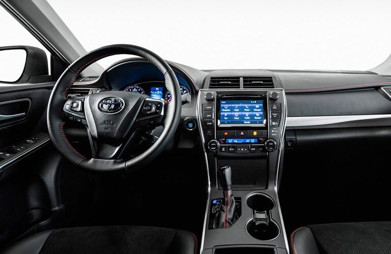 Look at the dashboard and steering wheel inside the 2017 Camry