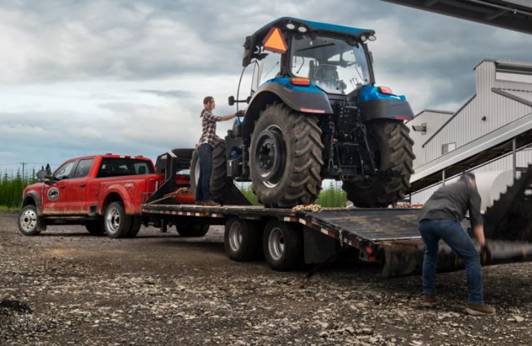 2026 Ford Super Duty towing a tractor