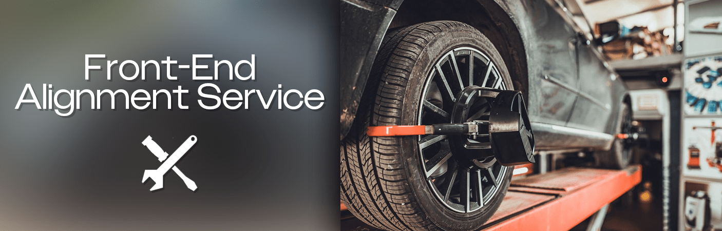 Technician undertaking a front-end alignment service