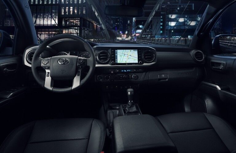 Steering wheel, gauges, and touchscreen in 2021 Toyota Tacoma