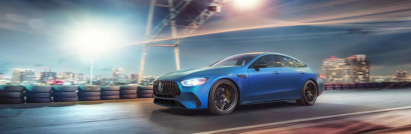 2024 Mercedes-AMG GT 43 4-door Coupe moving fast on a road