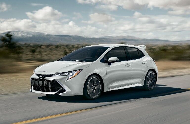 2022 Toyota Corolla Hatchback driving on a road