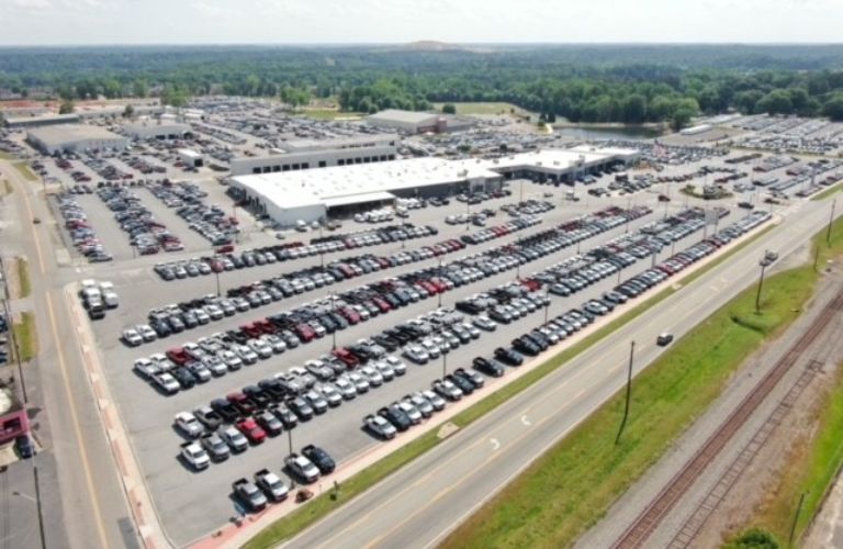 Ford F-450 inventory at Akins Ford in front of showroom
