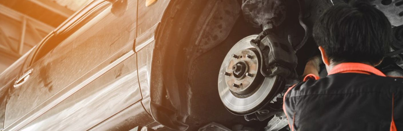 Technician checking brake pads