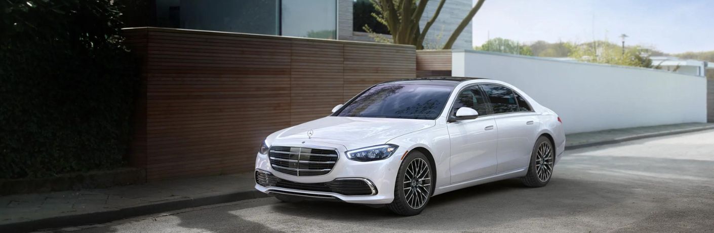 2024 Mercedes-Benz S 580e 4MATIC Sedan parked near a house