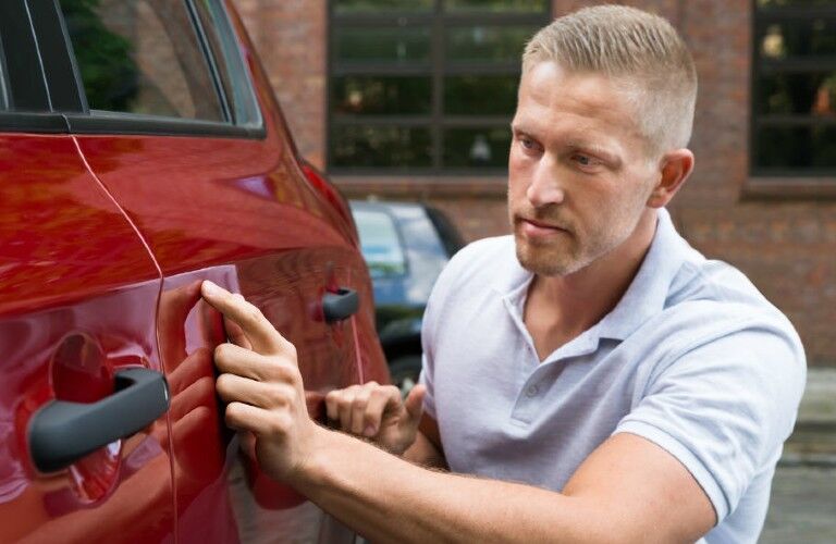Mechanic working on the body of a vehicle