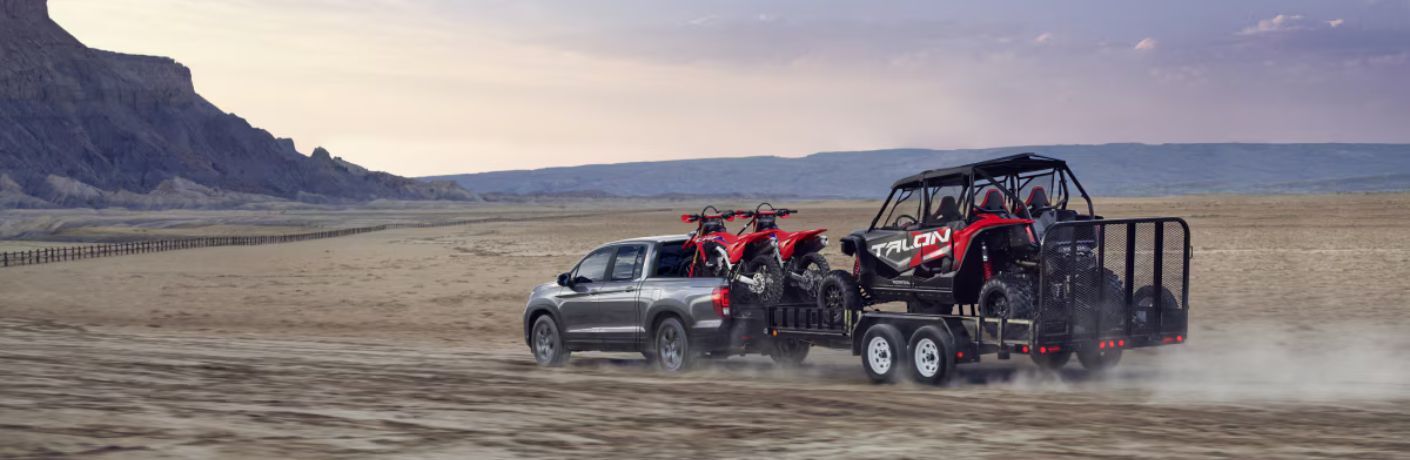 2025 Honda Ridgeline towing a motorbike trailer