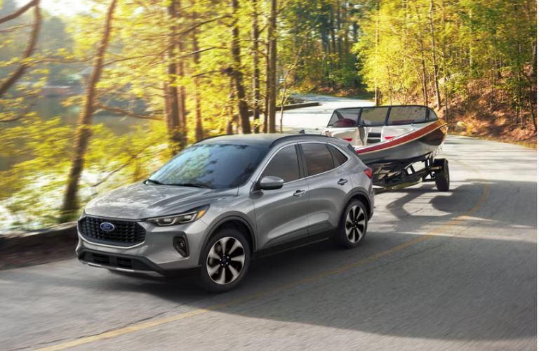 2024 Ford Escape Active towing a boat on the road