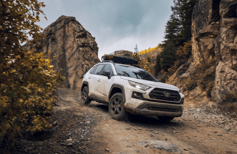Front view of the 2024 Toyota RAV4 on a rough terrain