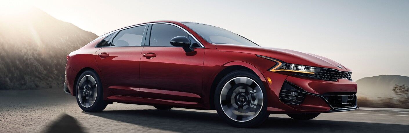 Red 2021 Kia K5 Side Exterior in the Desert