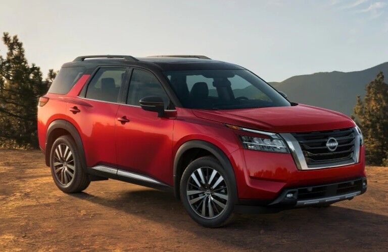Front passenger angle of a red 2022 Nissan Pathfinder