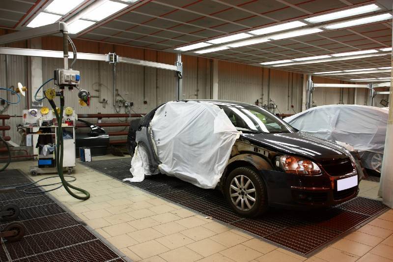 A car partway through the collision repair process, in a workshop