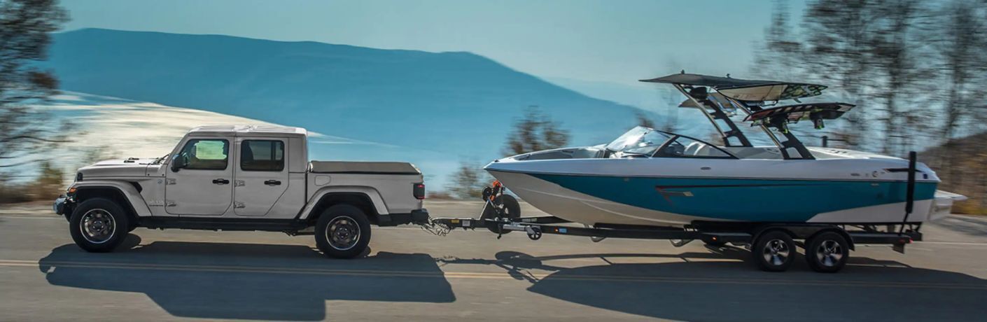 2023 Jeep Gladiator White towing a boat