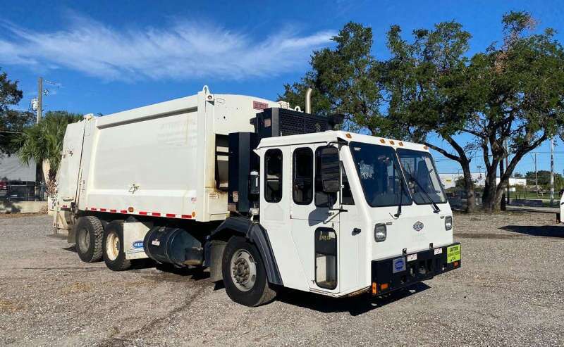 A used CCC garbage truck from Dirt Cheap Truck Sales in Tampa, FL.
