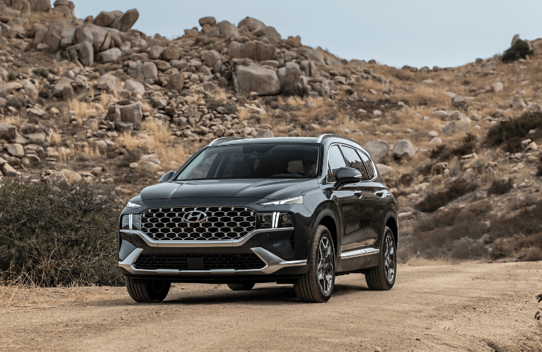 A 2023 Hyundai Santa Fe on a sandy terrain