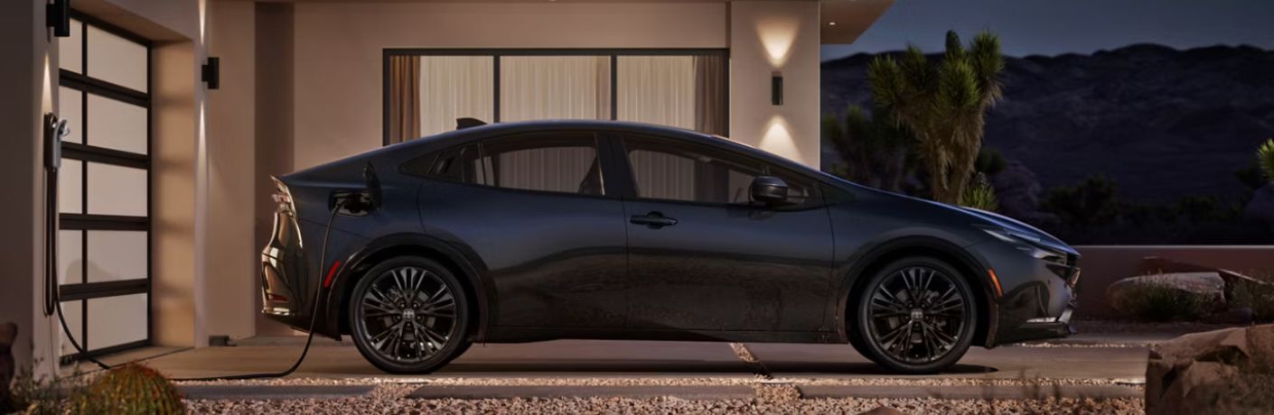 side view of the 2026 Toyota Prius Plug-In Hybrid being charged