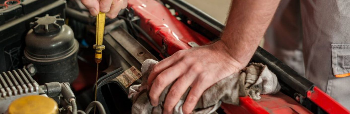 An image of a technician repairing the vehicle at the service center