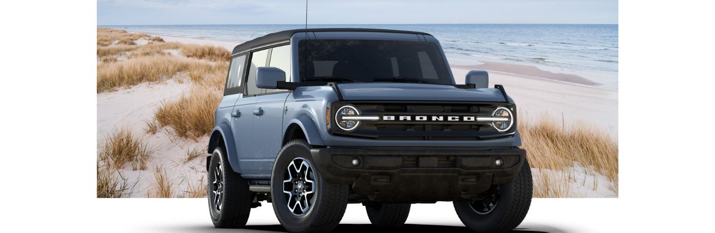 2025 Ford Bronco Outer Banks front view in front of a beach