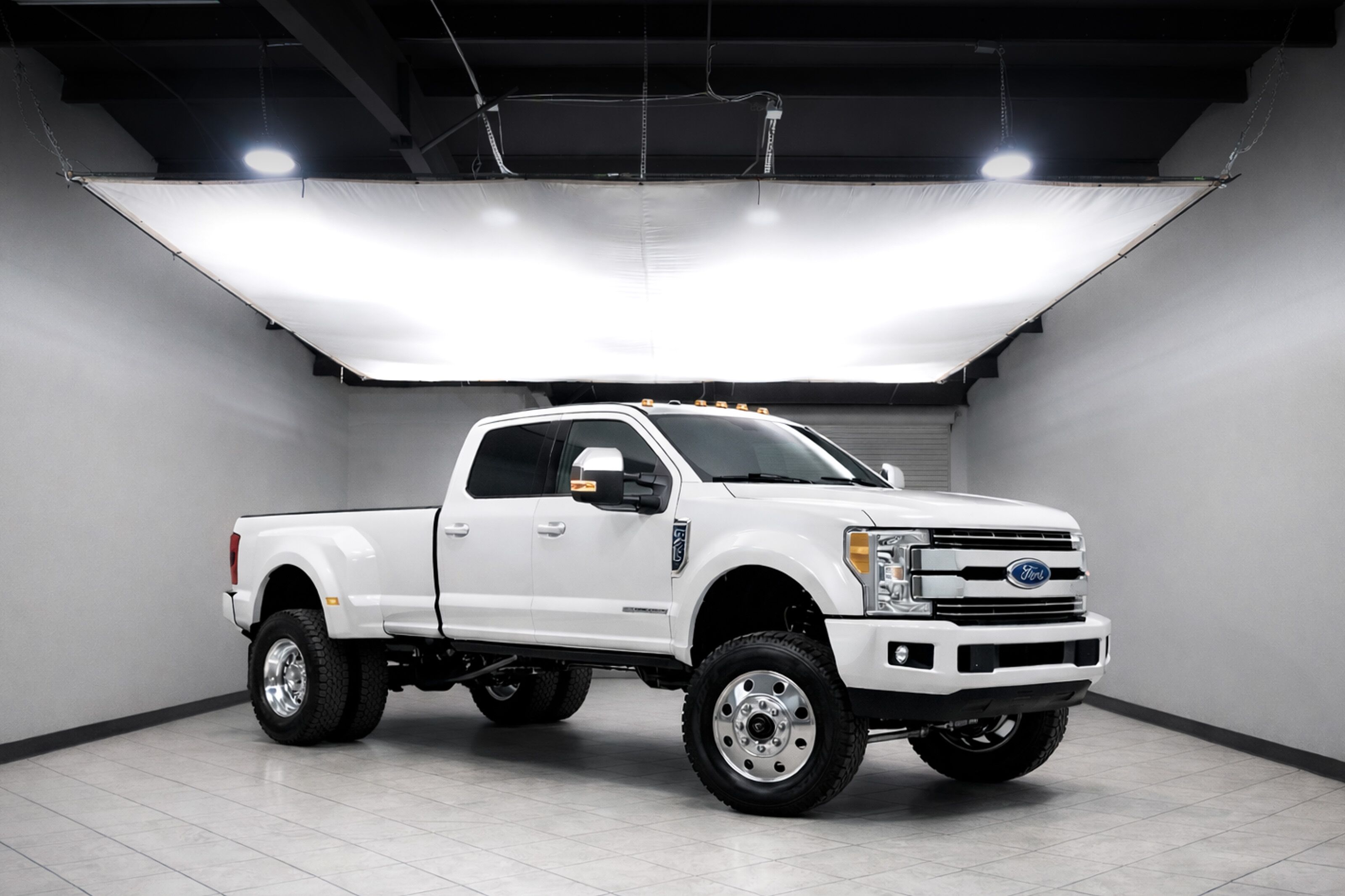 White heavy-duty diesel pickup truck photographed in the North Texas Truck Stop studio