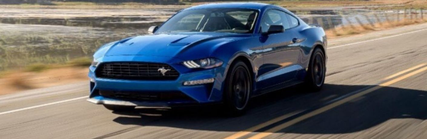 A 2020 Ford Mustang speeding on a smooth road