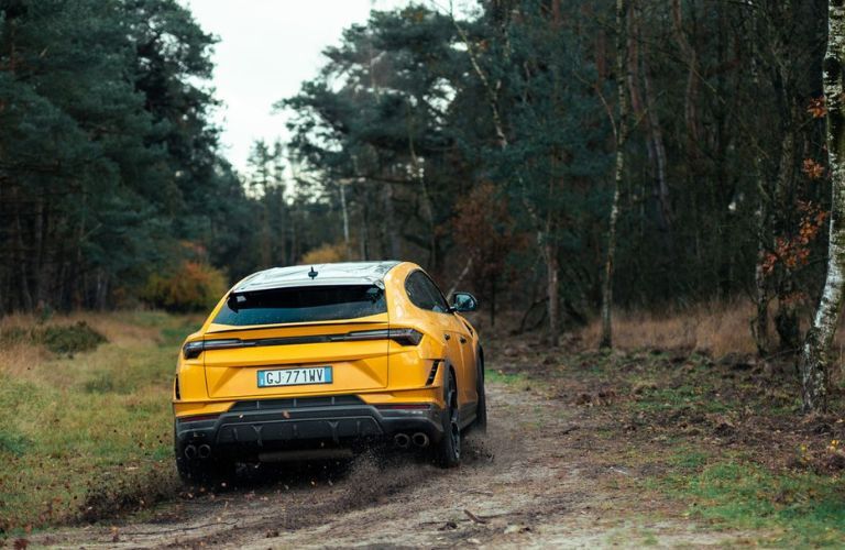 a Lamborghini SUV in an off-road path