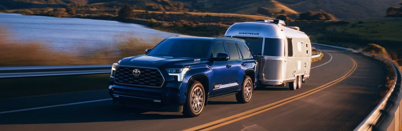 front quarter view of the 2025 Toyota Sequoia towing a trailer