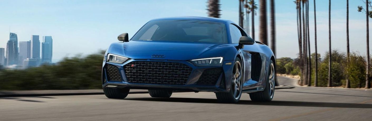 a blue Audi car on a road