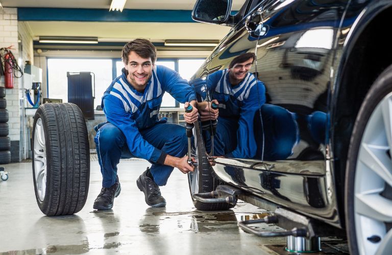 a service technician changing tires