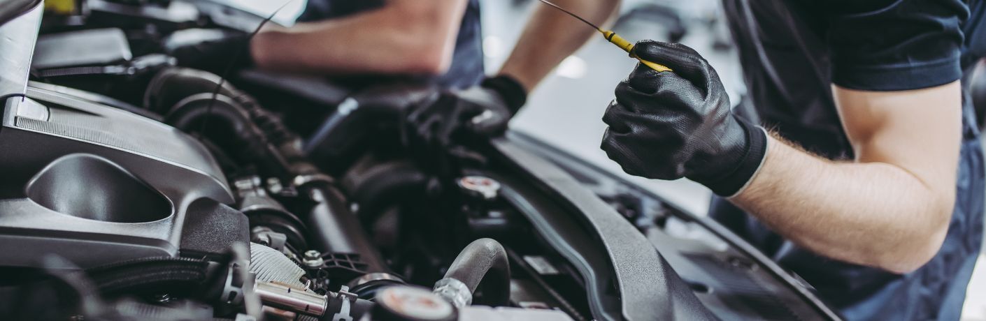 technicians servicing a vehicle