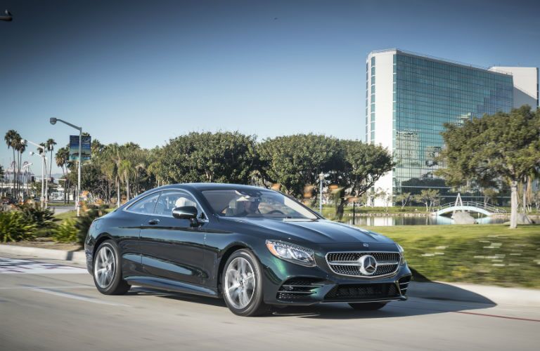 2018 MB S-Class Coupe exterior front fascia and passenger side on city road with trees