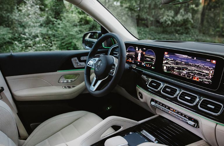 Front passenger view showing the steering wheel and 12.3-inch screens inside the 2022 Mercedes-Benz GLE SUV
