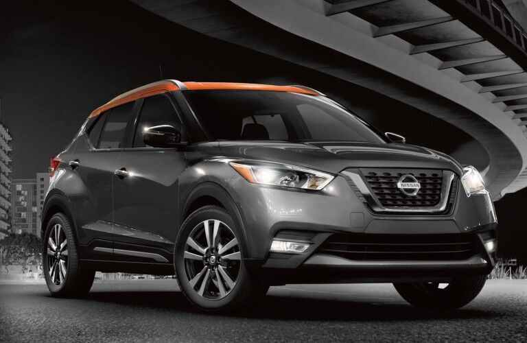 Front passenger angle of a grey 2020 Nissan Kicks with an orange roof
