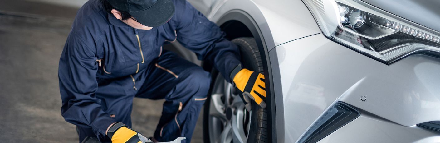 Technician inspecting a tire