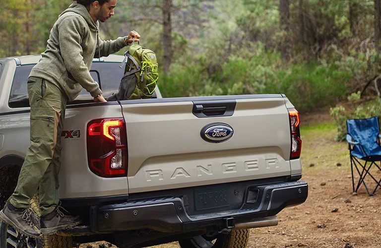 2025 Ford Ranger XL with someone getting something from the bed