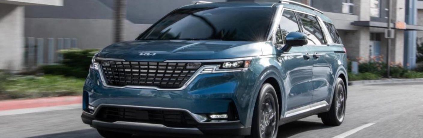 A 2022 Kia Carnival on a city road