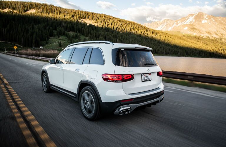 2020 MB GLB exterior back fascia and driver side in front of trees and mountain