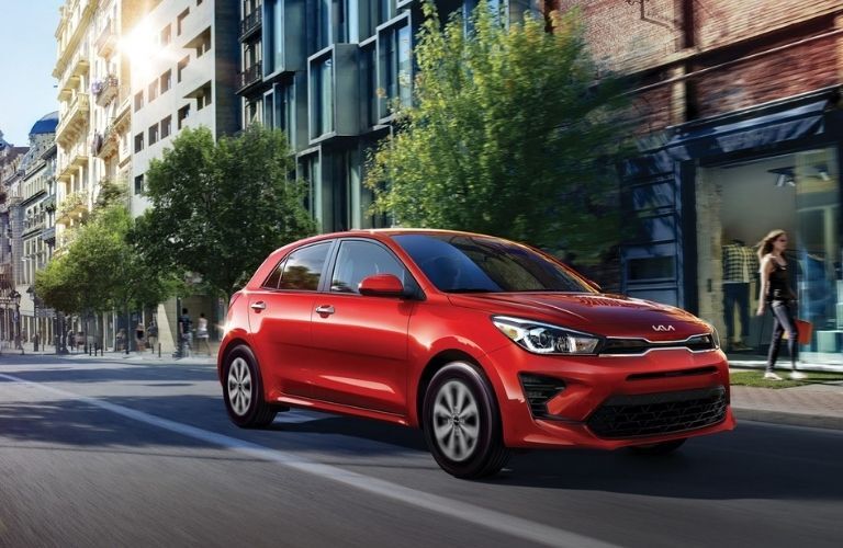 Red 2022 Kia Rio 5-Door Front Exterior on a City Street