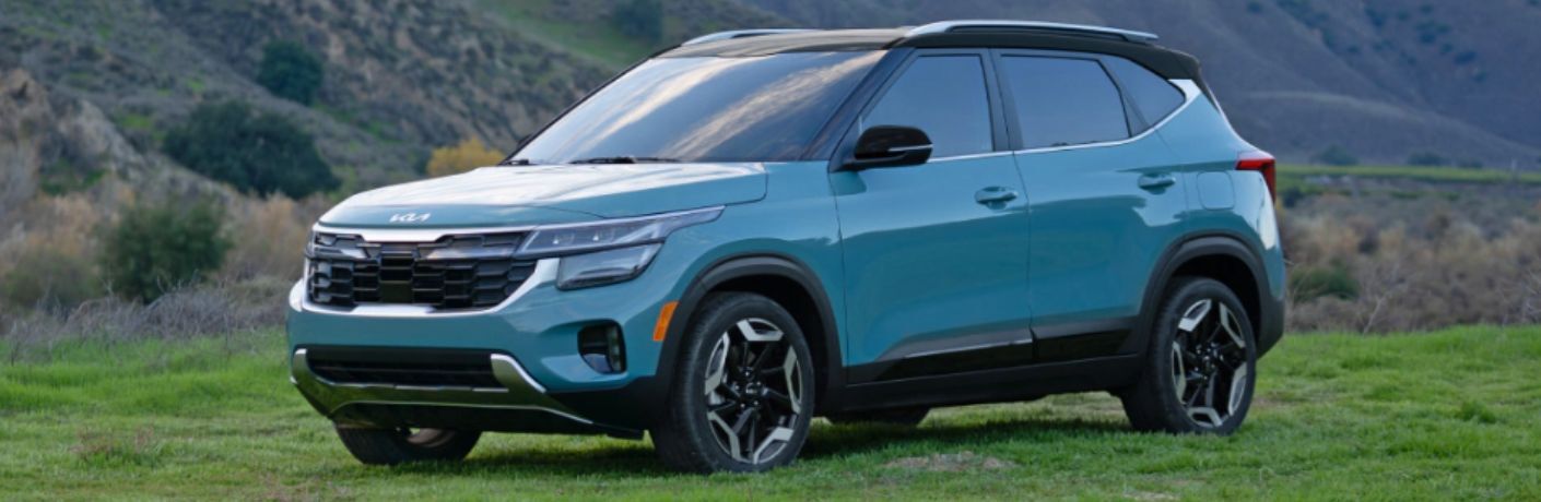 2024 Kia Seltos front quarter view parked in grass