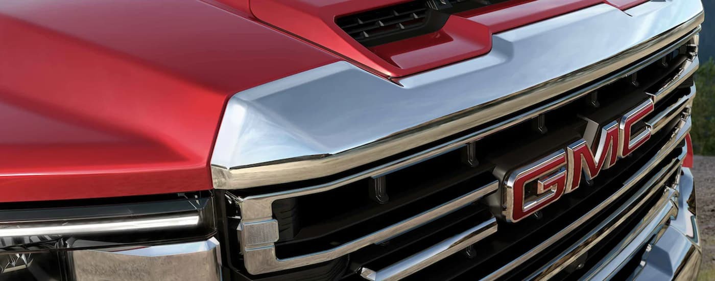 Grille on a red 2022 GMC Sierra 2500HD used truck for sale