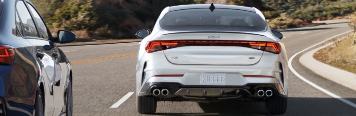 Rear view of the 2023 Kia K5 GT on road