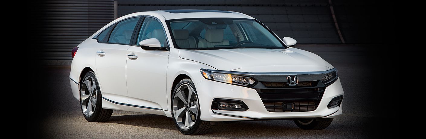 Exterior view of white 2018 Honda Accord parked inside a warehouse