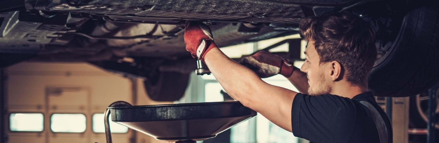 A mechanic working on a vehicle
