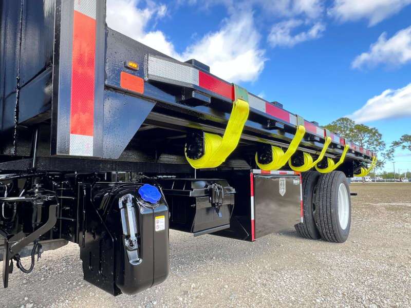 THe heavy duty tie downs on a large flatbed truck